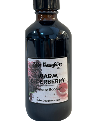 Sebi’s Daughters Warm Elderberry Tea – 8oz limited edition herbal tea blend with elderberries, blackberries, clove, and spring water in a clear bottle with a minimalist label, displayed on a transparent background