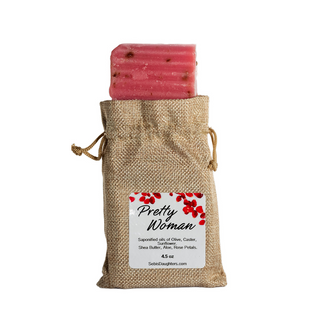 Sebi's Daughters Pretty Woman Rose Soap Bar in a burlap sack that closes on the sides with drawstrings on each side.